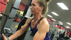 Amy Miller flex co owner fitness coach doing cable crossovers and getting fit